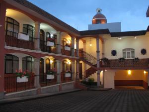 a building with a lighthouse on top of it at Hotel Colonial in Teziutlán