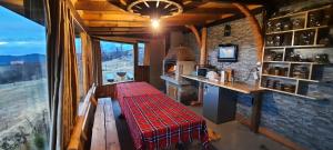 a kitchen with a counter and a table in a room at Вила Орцево Vila Ortsevo in Ortsevo