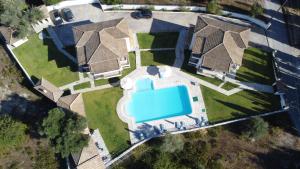 an overhead view of a house with a pool at Villa Agni in Yénion