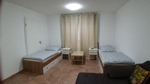 Postel nebo postele na pokoji v ubytování Pension Chen
