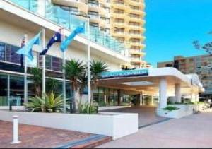 a building with blue arrows on the side of it at U1 - Relaxing “Seaview’s” from your balcony in Gold Coast