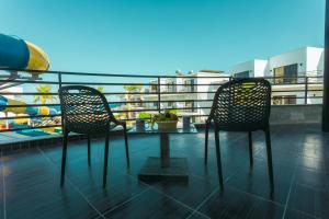 A balcony or terrace at La Rosa Waves Beach - Couple & Families Only