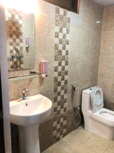 a bathroom with a sink and a toilet at Hotel Attic Empire in Kathmandu +45 photos