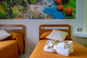 Ліжко або ліжка в номері Casa Vacanze dell'Angelo