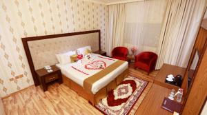 Postel nebo postele na pokoji v ubytování Ras Al Khaimah Hotel