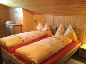 A bed or beds in a room at Chalet Marder