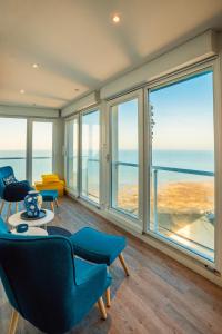 a living room with a view of the ocean at La tête Ault - Une expérience unique en bord de Mer in Ault
