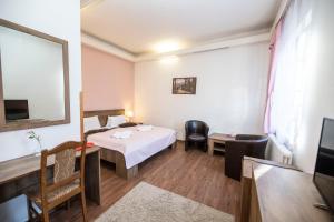 Posteľ alebo postele v izbe v ubytovaní Hotel Džbán