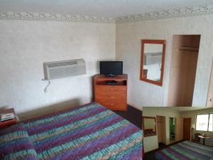 Postel nebo postele na pokoji v ubytování Red Carpet Inn Brooklawn + 6 fotografií