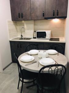 Η κουζίνα ή μικρή κουζίνα στο Welcome Apartments в центре