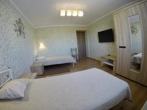 מיטה או מיטות בחדר ב-Бутік-отель "Lavanda"