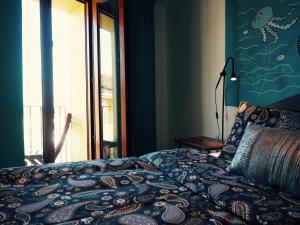 a bedroom with a bed and a window at LA SIRENA - Both city and beach of Denia in Denia