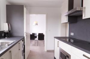 Η κουζίνα ή μικρή κουζίνα στο Helles & modernes Apartment am Karlsplatz