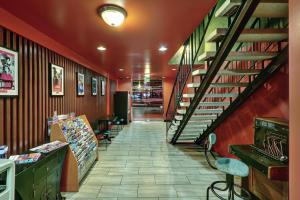 a hallway with a staircase in a store at Royal Pagoda Motel Dodger Stadium in Los Angeles