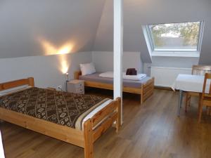 Katil atau katil-katil dalam bilik di Pension Ziemann