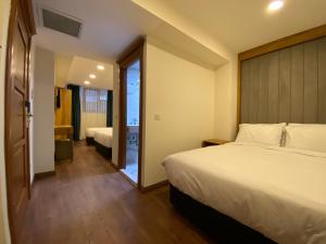 a hotel room with a bed and a sliding glass door at Pege Hotel in Istanbul