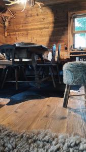 a wooden cabin with a wooden table and a bench at Berghütte Wattenberg in Wattenberg +45 photos