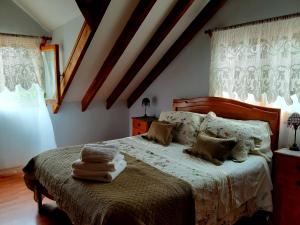 Postel nebo postele na pokoji v ubytování Casa Emiluz