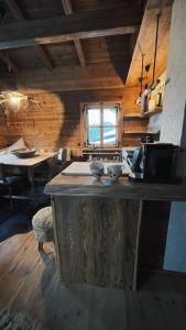 a kitchen with a counter in a wooden cabin at Berghütte Wattenberg in Wattenberg