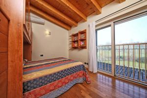 Ένα ή περισσότερα κρεβάτια σε δωμάτιο στο Il Colombaro