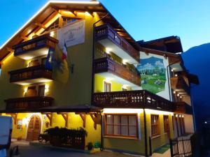 a large building with balconies on the side of it at Park Residence Imperator in Carisolo