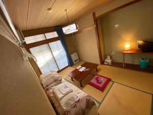Postel nebo postele na pokoji v ubytování Nozawa Dream Central