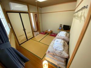 Postel nebo postele na pokoji v ubytování Nozawa Dream Central