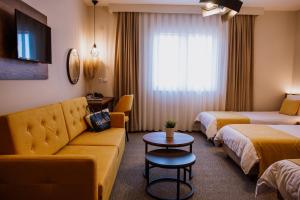 Postel nebo postele na pokoji v ubytování Hotel Kapri