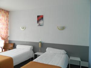 Ένα ή περισσότερα κρεβάτια σε δωμάτιο στο L'Elancèze