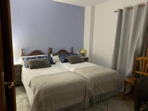 Cama o camas de una habitación en La Fusteria del Casat