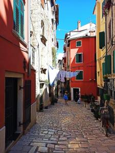 a street scene with people walking down the street at Casa Casale in Rovinj