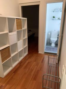 a bathroom with a toilet in a room at City Pearl in Jyväskylä +14 photos