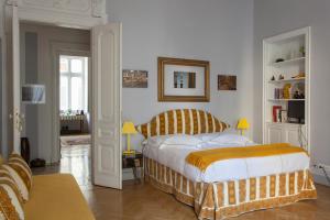 Postel nebo postele na pokoji v ubytování Palazzo Bellini