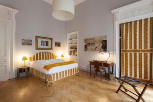 Postel nebo postele na pokoji v ubytování Palazzo Bellini