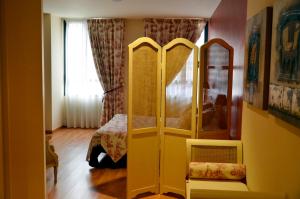 Postel nebo postele na pokoji v ubytování Hospedium Hotel Vittoria Colonna