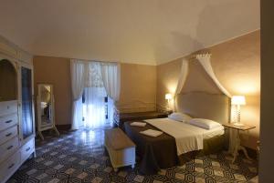 Letto o letti in una camera di Borgo del Carato