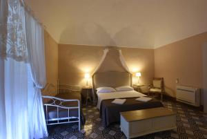 Letto o letti in una camera di Borgo del Carato