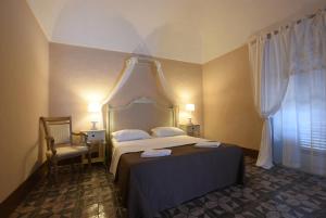 Letto o letti in una camera di Borgo del Carato
