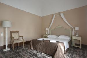 Letto o letti in una camera di Borgo del Carato