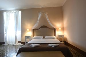 Letto o letti in una camera di Borgo del Carato
