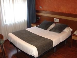 Postel nebo postele na pokoji v ubytování Hotel Iris