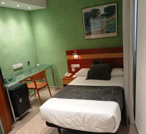 Postel nebo postele na pokoji v ubytování Hotel Iris