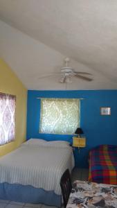 Ένα ή περισσότερα κρεβάτια σε δωμάτιο στο Coco Cabanas Loreto