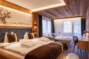 Postel nebo postele na pokoji v ubytování Silvana Mountain Hotel