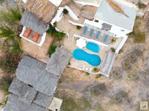 an overhead view of a house with a swimming pool at Hotel Smiling Crab in Canoas de Punta Sal