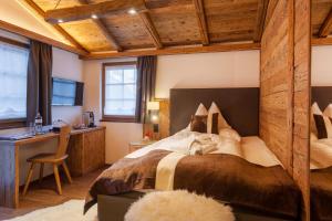 Postel nebo postele na pokoji v ubytování Silvana Mountain Hotel