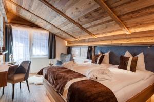 Postel nebo postele na pokoji v ubytování Silvana Mountain Hotel