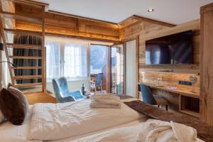 Postel nebo postele na pokoji v ubytování Silvana Mountain Hotel