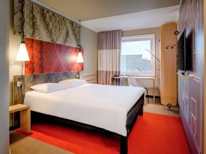 Postel nebo postele na pokoji v ubytování Ibis Münster City
