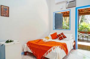 Cama ou camas em um quarto em Ganga Zumba Pousada & Hostel